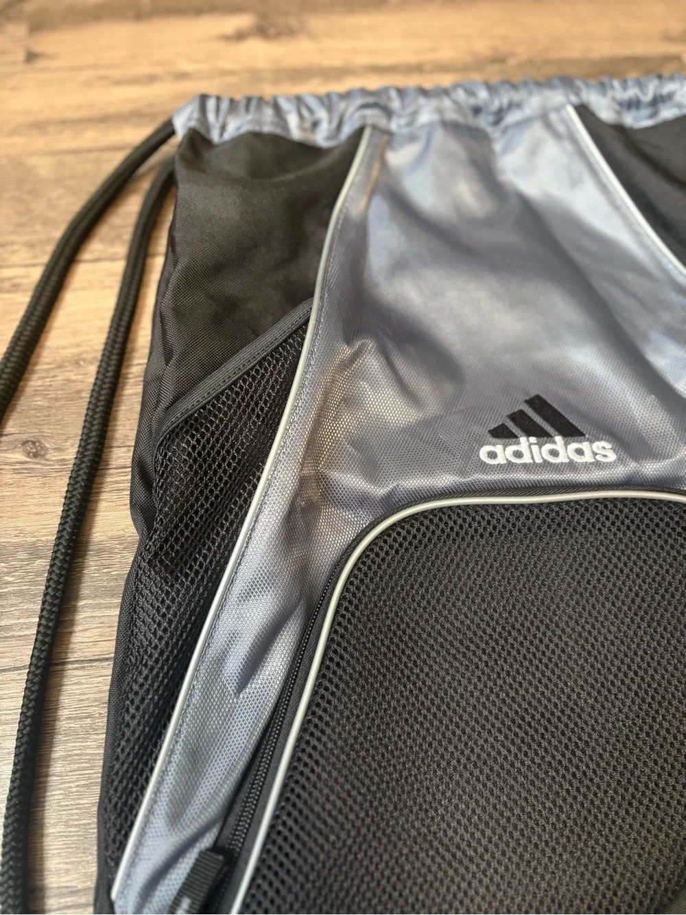 adidas Black and Silver Drawstring Backpack with Front Zip Pocket